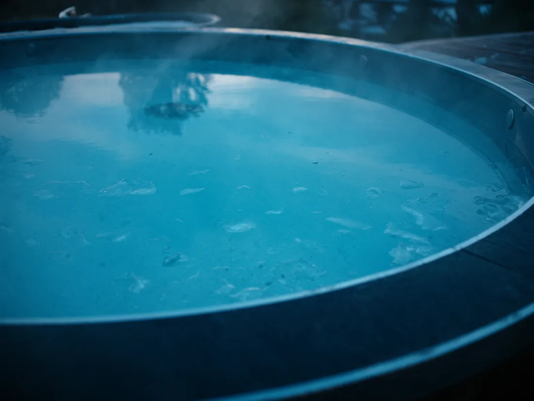 Steam rising off an ice bath at first light