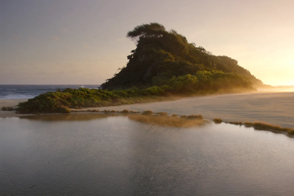 Sunrise over a Sunshine Coast lagoon and headland